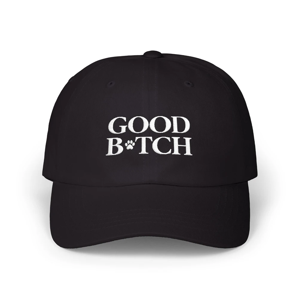 Black GOOD B*TCH cap with white embroidered lettering and paw-print mark
