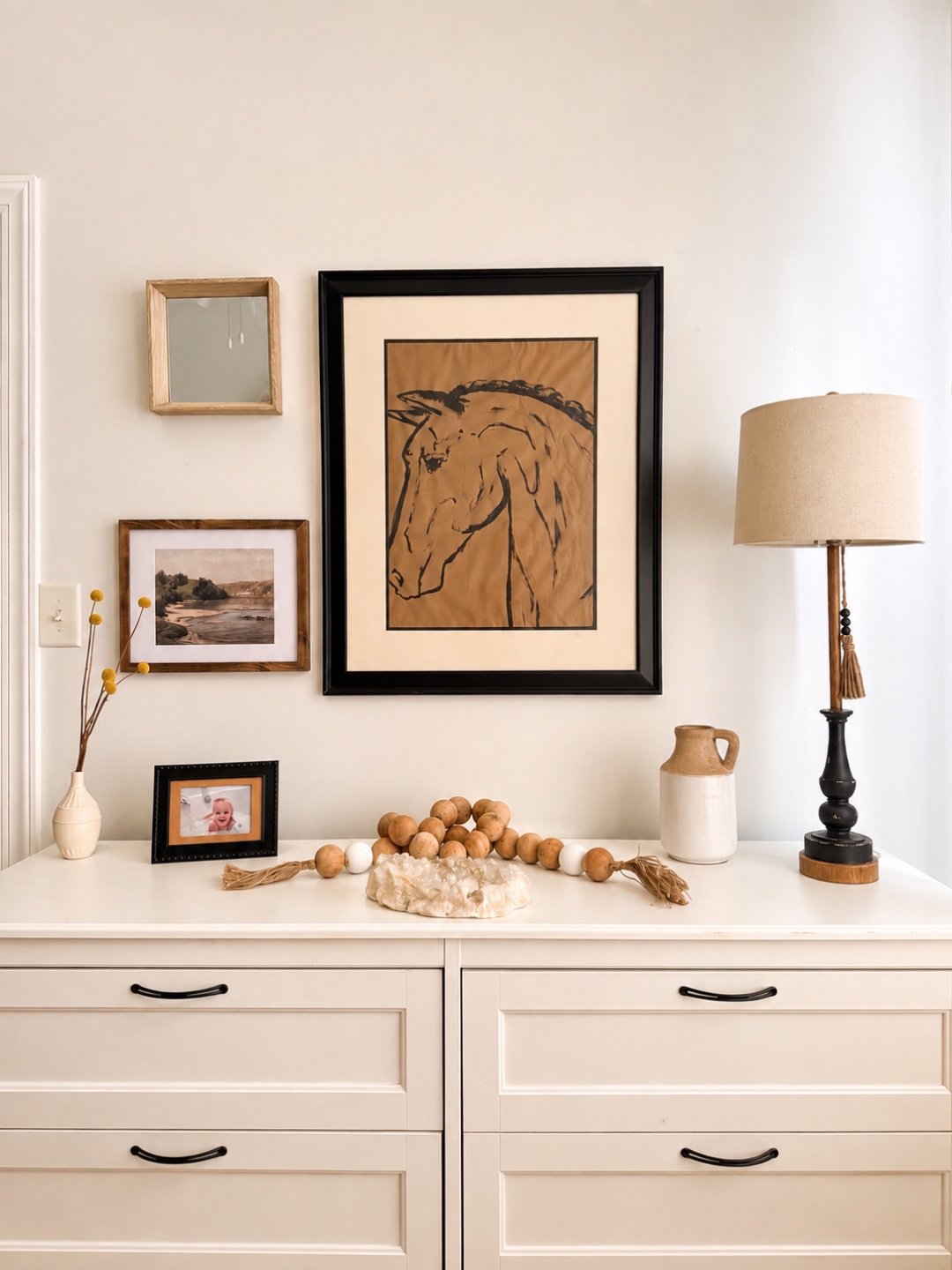Dresser vignette with horse illustration and pottery