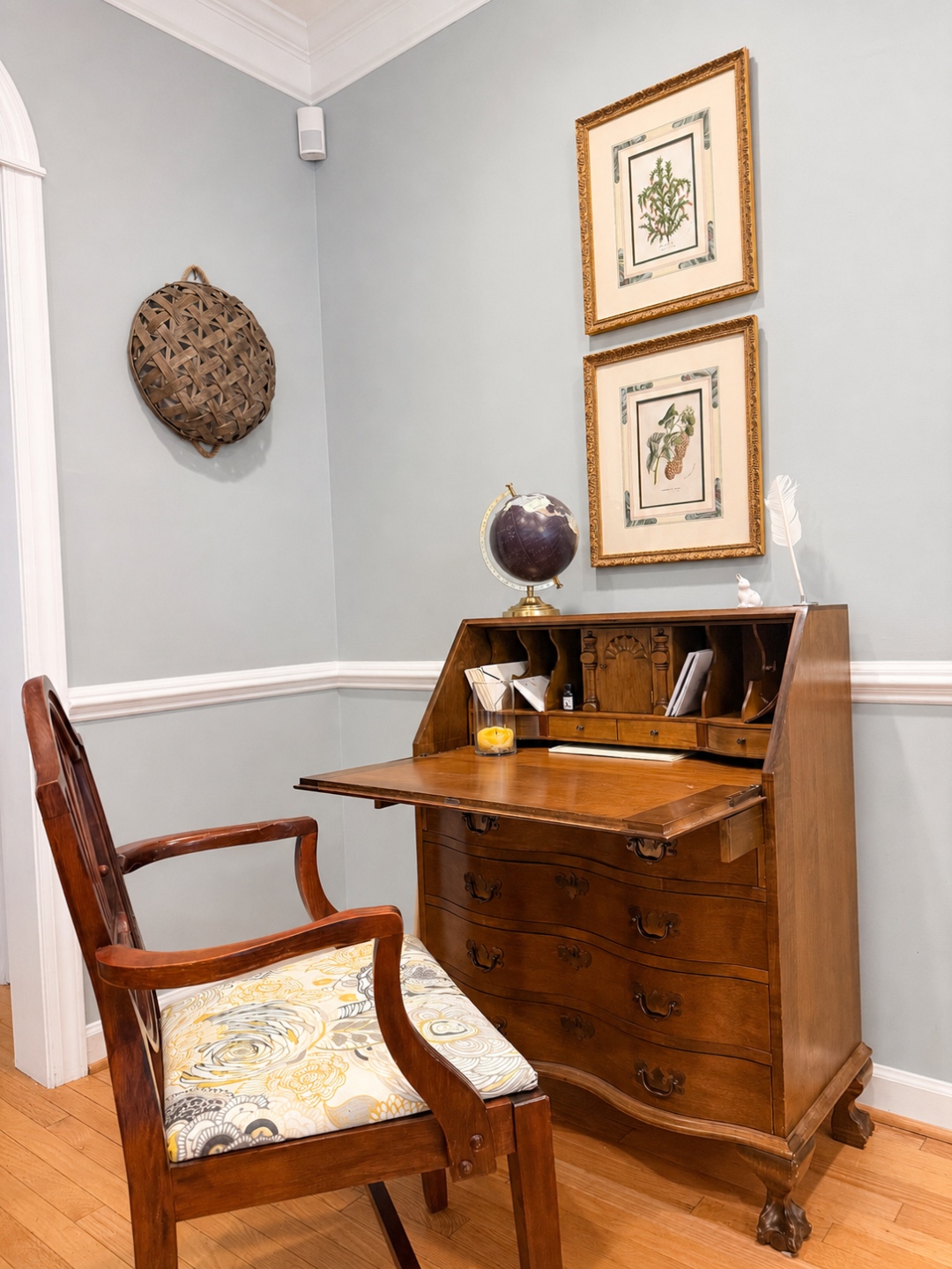 Antique writing secretary with botanical prints and globe