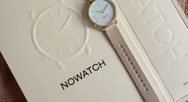 A NOWATCH timepiece and its packaging